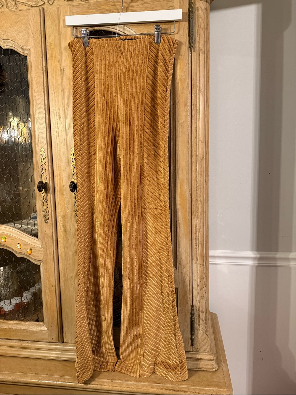 Free People High-Waist Velvet Flared Pants in Mustard